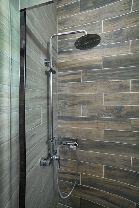 Shower, rainfall showerhead, hair dryer, towels