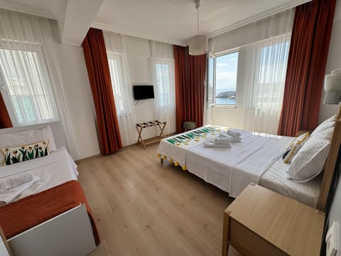 Standard Triple Room, Sea View | Minibar, free WiFi