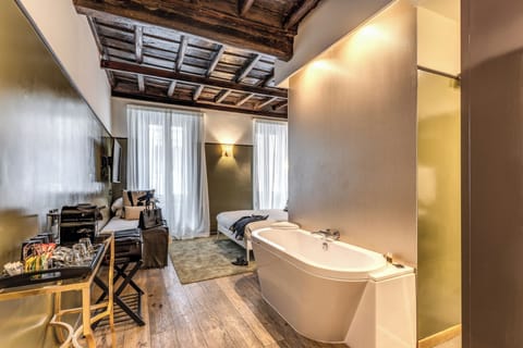 Deluxe Triple Room, City View | In-room safe, desk, laptop workspace, soundproofing