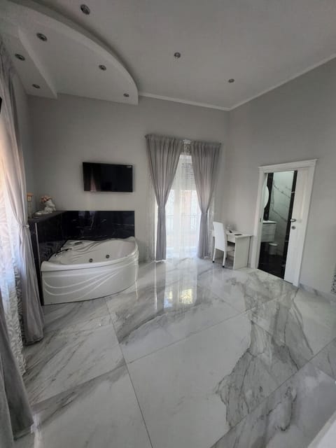Superior Suite, Balcony, City View | In-room safe, desk, laptop workspace, blackout drapes