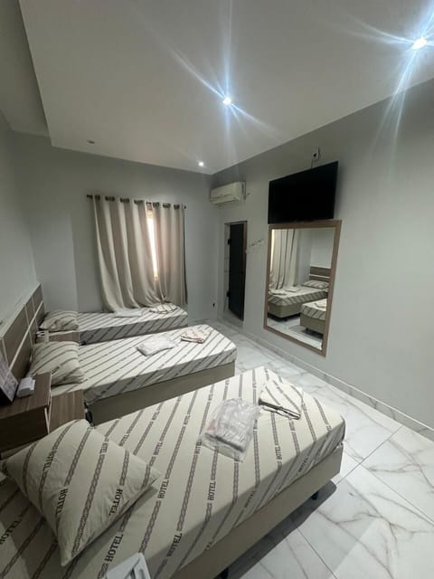 Economy Triple Room | Desk, laptop workspace, free WiFi