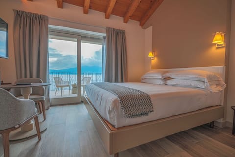 Junior Suite, Terrace, Lake View | In-room safe, desk, laptop workspace, blackout drapes