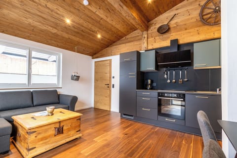 Comfort Apartment, 1 Bedroom, Balcony, Mountain View | Living area | 50-inch flat-screen TV with cable channels
