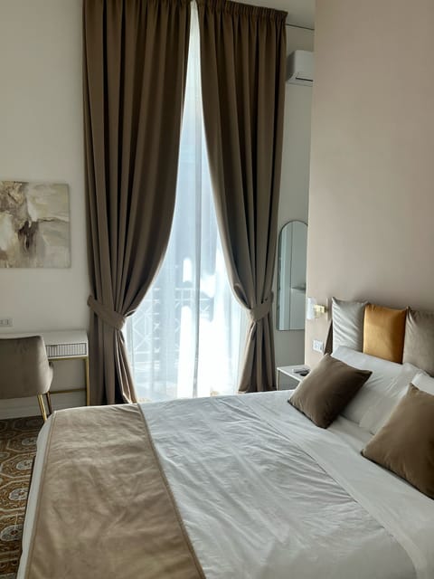 Superior Room, Balcony | Minibar, in-room safe, desk, blackout drapes