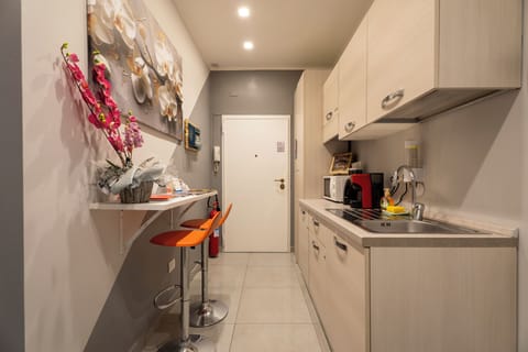 Mini-fridge, microwave, cookware/dishes/utensils