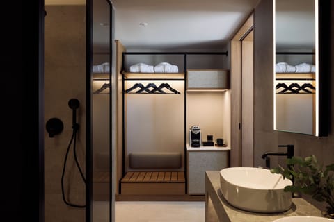 Shower, hair dryer, slippers, towels