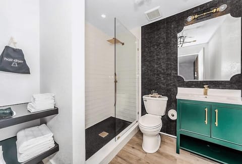 1 Legend | Bathroom | Shower, rainfall showerhead, hair dryer, towels