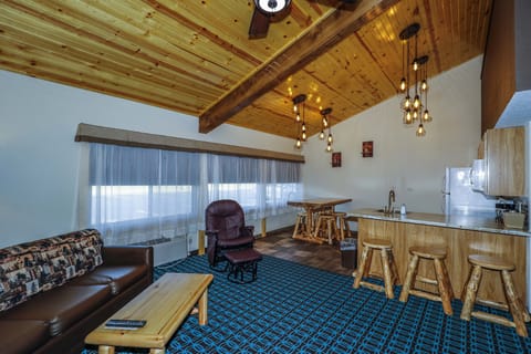 Family Suite, 3 Bedrooms, Kitchen | Living area | Flat-screen TV