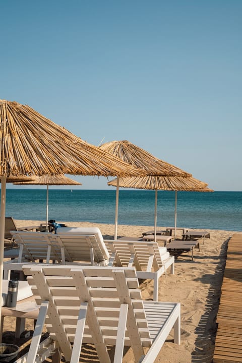 Private beach, free beach shuttle, free beach cabanas, sun loungers