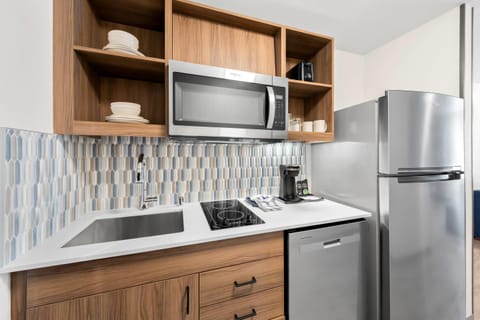 Suite, 1 King Bed, Non Smoking | Desk, laptop workspace, blackout drapes, iron/ironing board