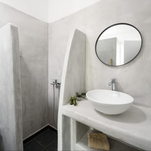 Shower, hair dryer, slippers, towels