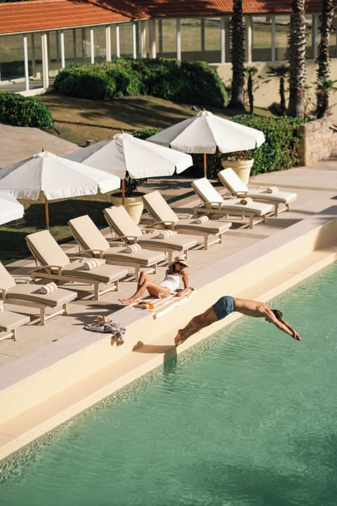 Outdoor pool, open 8:00 AM to 10:00 PM, pool umbrellas, sun loungers
