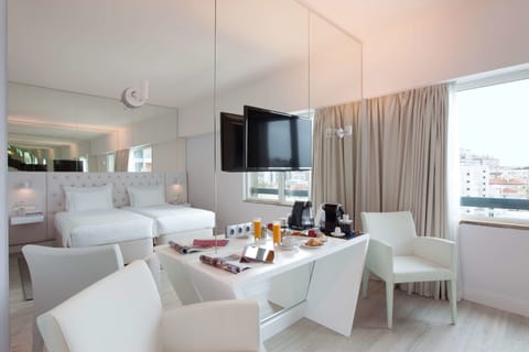 Family Room, City View | Minibar, in-room safe, desk, blackout drapes