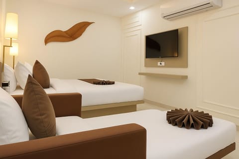 Deluxe Triple Room, Lanai | Premium bedding, laptop workspace, blackout drapes, soundproofing