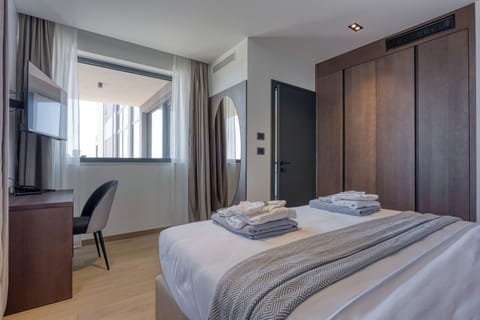 Standard Suite, Balcony, Partial Sea View | In-room safe, desk, laptop workspace, blackout drapes