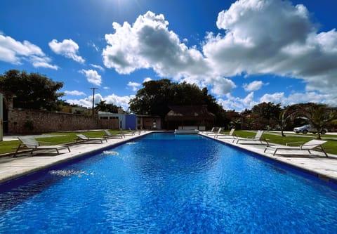 Outdoor pool, open 8:00 AM to 9:00 PM, sun loungers