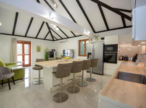 Villa (Three Bedroom Villa with Outdoor Pool) | Living room | 32-inch flat-screen TV with satellite channels