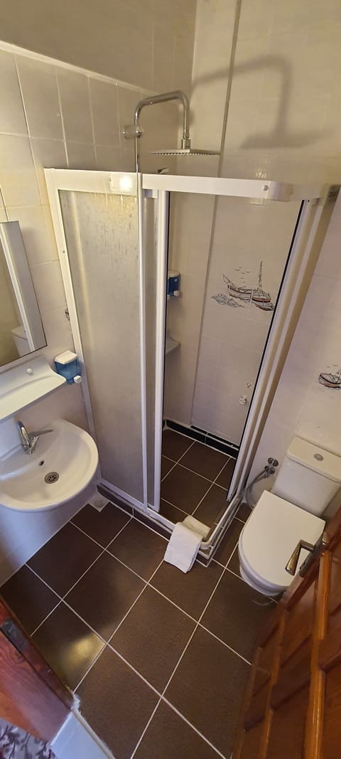 Shower, free toiletries, hair dryer, slippers