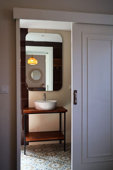 Shower, hair dryer, slippers, towels