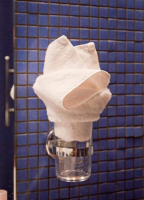 Basic Triple Room, Balcony, City View | Bathroom | Shower, hair dryer, slippers, towels