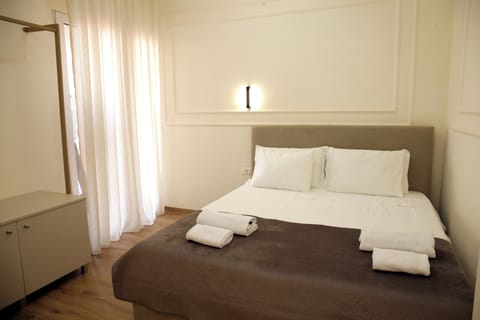 Family Quadruple Room, Balcony, City View | Iron/ironing board, free WiFi