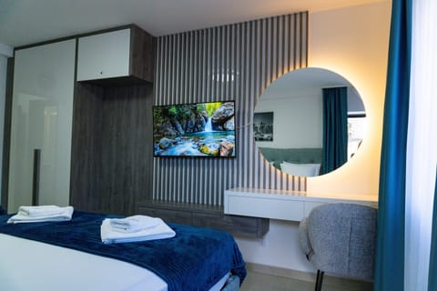 Deluxe Triple Room, Balcony, City View | Desk, free WiFi