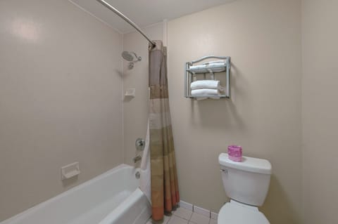 Desk, laptop workspace, blackout drapes, iron/ironing board