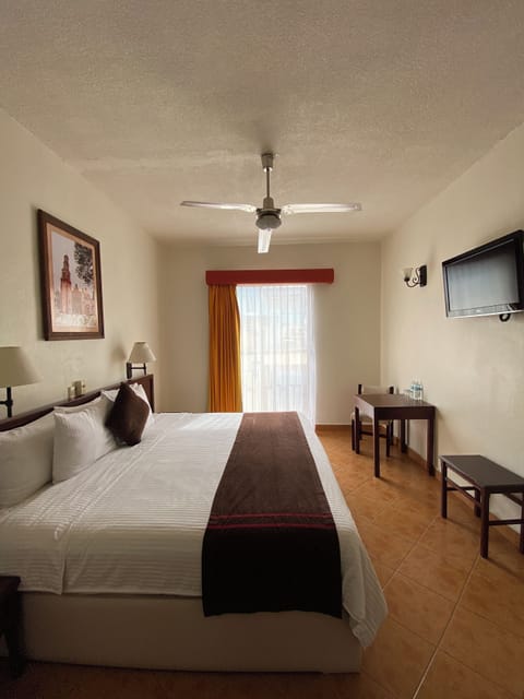 Standard Room, 1 King Bed, Non Smoking, City View | Desk, blackout drapes, free WiFi, bed sheets