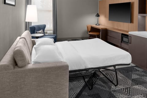 Suite, 1 King Bed | Living area | 32-inch LCD TV with cable channels, TV