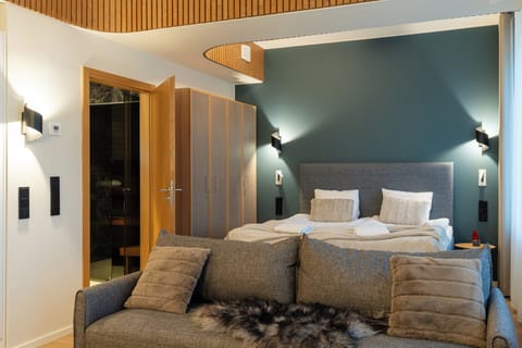 Deluxe Room, Sauna | Blackout drapes, soundproofing, iron/ironing board, cribs/infant beds