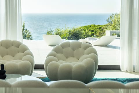 Villa, Sea View | Living area | 60-inch Smart TV with digital channels