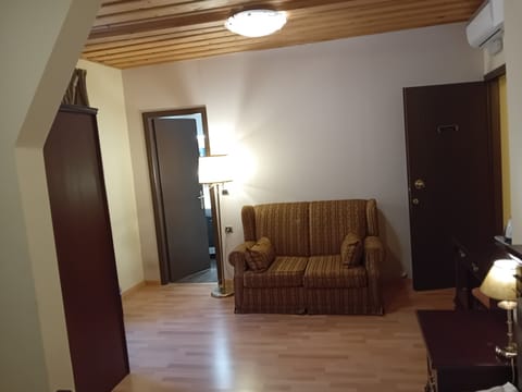 Deluxe Double Room, City View | Living area | 32-inch flat-screen TV with digital channels