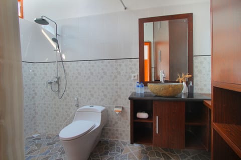 Shower, free toiletries, slippers, towels