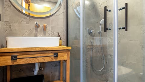 Deluxe Double Room, Balcony, City View | Bathroom | Shower, hair dryer, slippers, towels