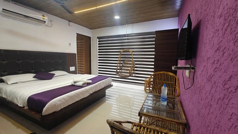 Deluxe Room, Balcony | Living area | 32-inch Smart TV with digital channels