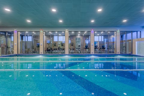 Indoor pool, seasonal outdoor pool, pool umbrellas, sun loungers