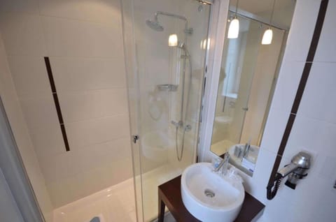 Shower, eco-friendly toiletries, hair dryer, towels