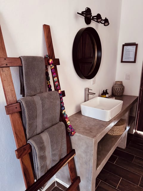 Single Room, 1 Queen Bed | Bathroom | Shower, rainfall showerhead, towels, soap