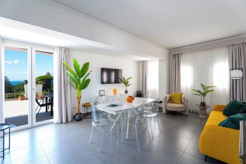 Design Apartment, 2 Bedrooms, Sea View | Living area | 55-inch Smart TV with satellite channels