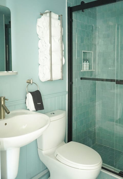 Combined shower/tub, designer toiletries, hair dryer, bathrobes