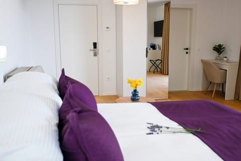 Deluxe Double Room, Balcony, Sea View | In-room safe, desk, laptop workspace, blackout drapes