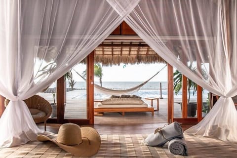 Deluxe Suite, Beach View | Premium bedding, minibar, in-room safe, laptop workspace