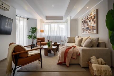 Deluxe Apartment, 3 Bedrooms, Balcony, City View | Living area | 43-inch Smart TV with cable channels, Netflix, streaming services