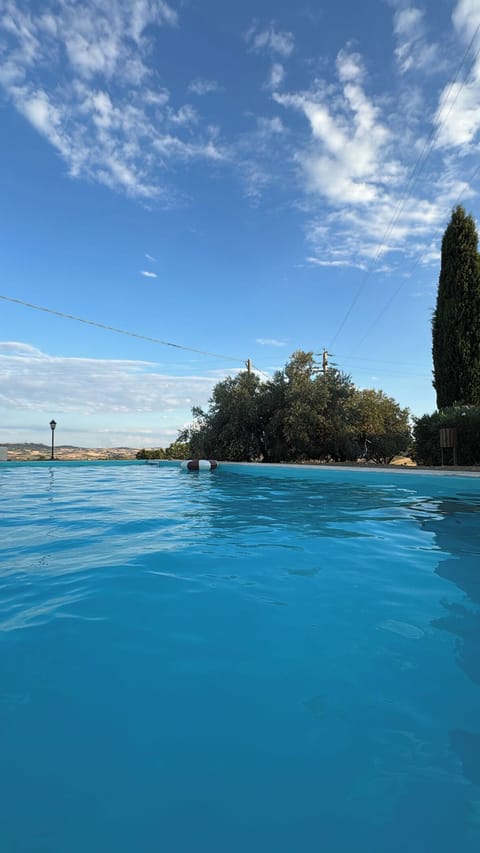 Seasonal outdoor pool, open 9:00 AM to 8:00 PM, pool umbrellas