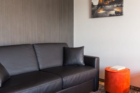 Executive Quadruple Room | Living area | Flat-screen TV