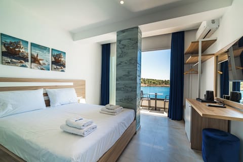 Deluxe Double Room, Balcony, Beach View | In-room safe, desk, free WiFi