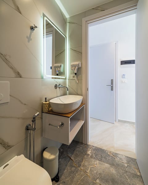 Deluxe Double Room, Balcony, Beach View | Bathroom | Shower, hair dryer, towels, soap