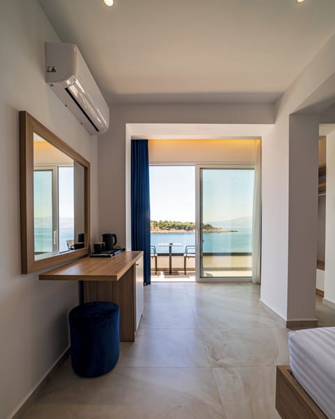 Deluxe Double Room, Balcony, Beach View | In-room safe, desk, free WiFi