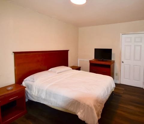 Room, 2 Queen Beds, Smoking | In-room safe, iron/ironing board, free WiFi, bed sheets