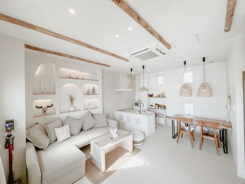 Design Quadruple Room, 1 Queen Bed with Sofa bed, Non Smoking, Beach View | Living area | 50-inch flat-screen TV with digital channels